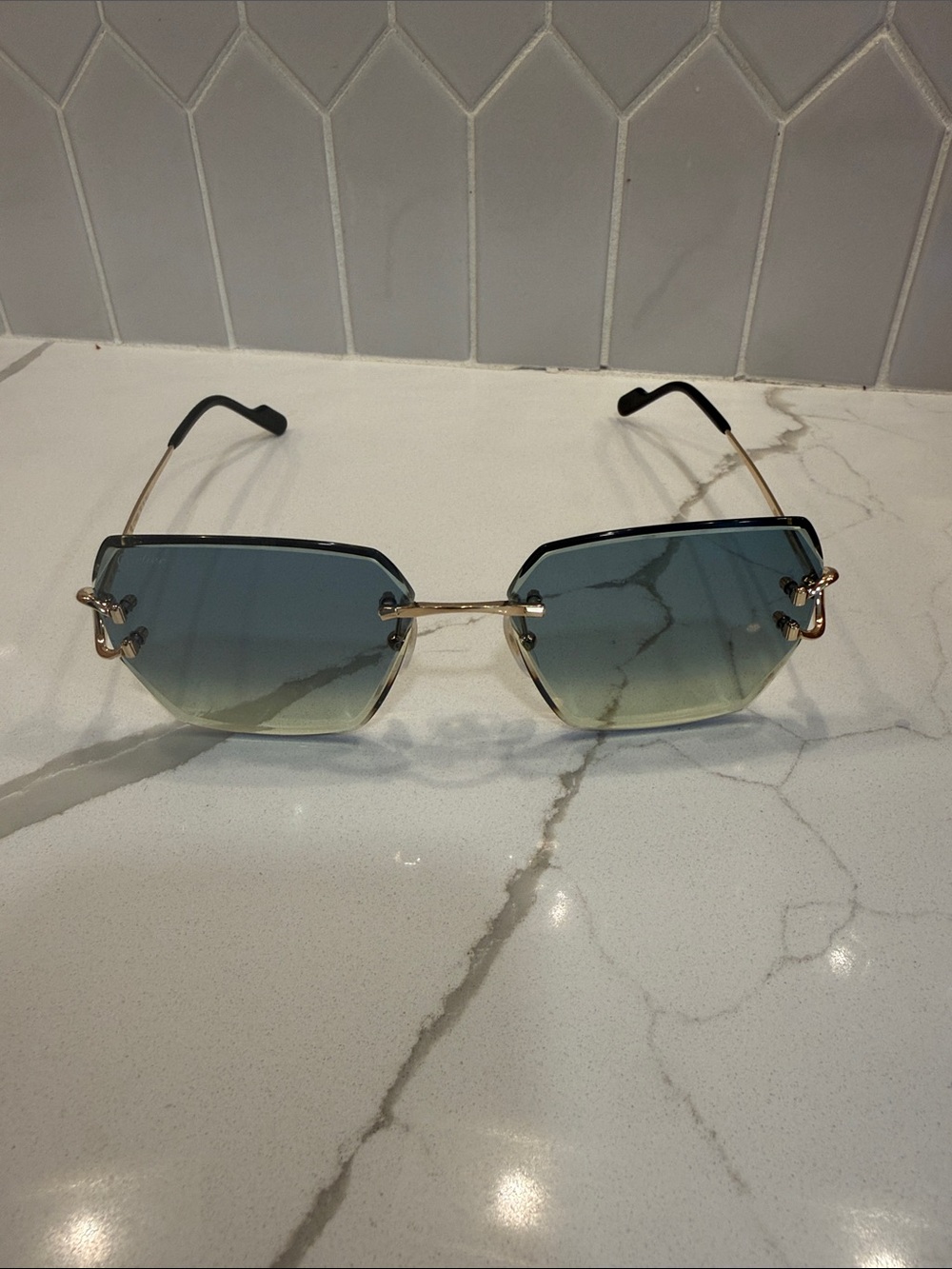 Cartier Blue Gradient Rimless Sunglasses with Gold Accents
